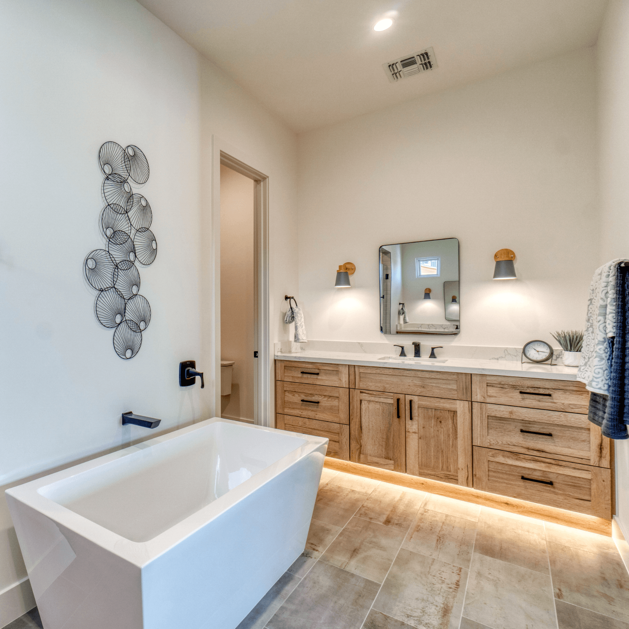 Warm wood cabinets in master bath